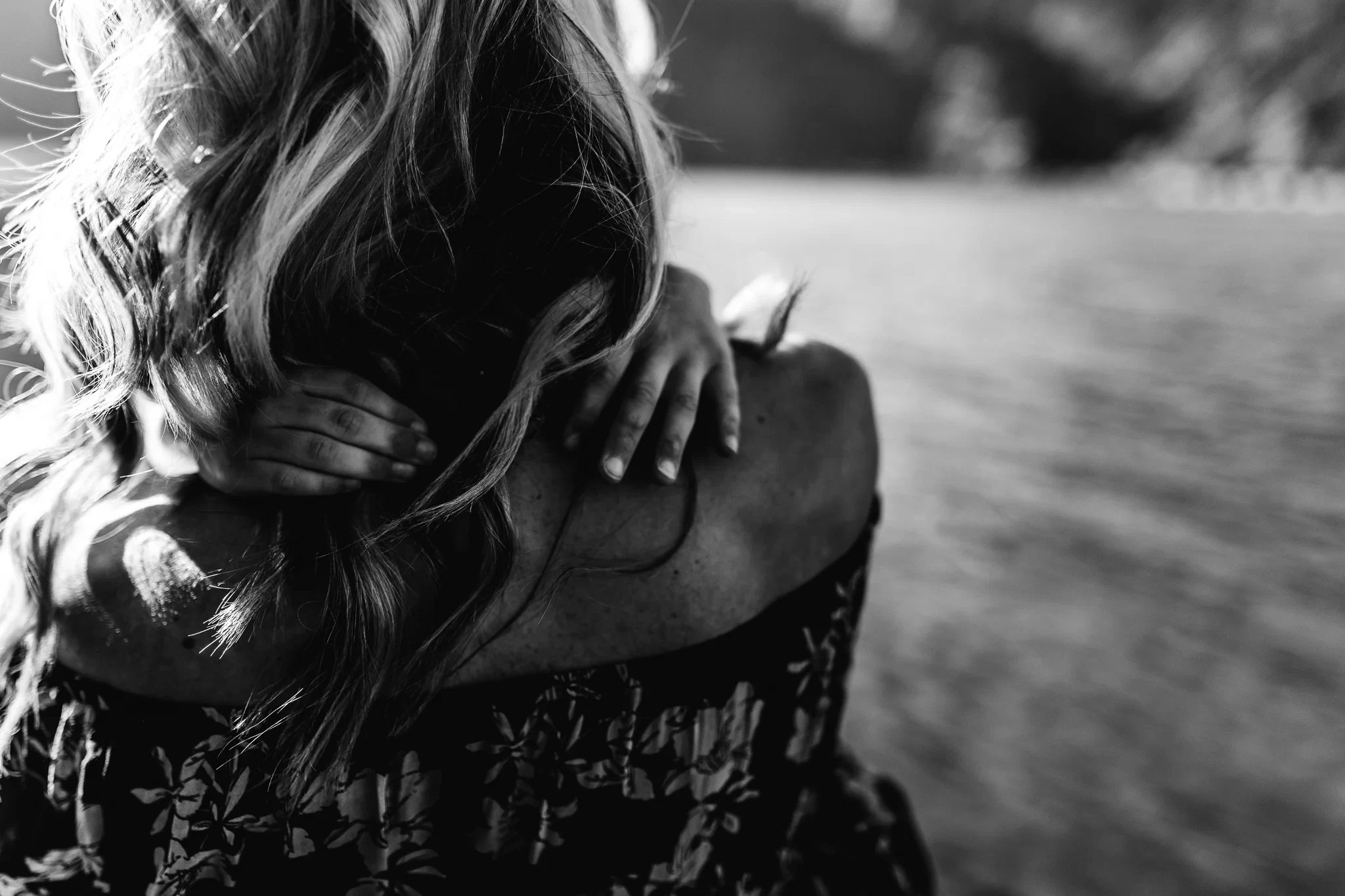 Parent and child embracing in a black-and-white photograph